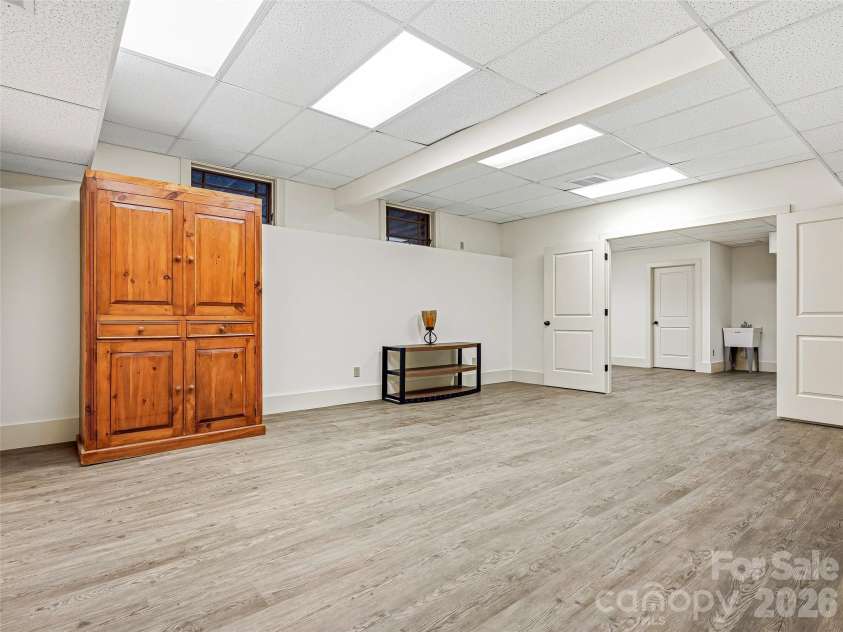 1606 Olmsted Drive, Asheville, NC 28803.  MLS# CAR4407499, YatesRealty ID 42832. View back through entertainment space and studio