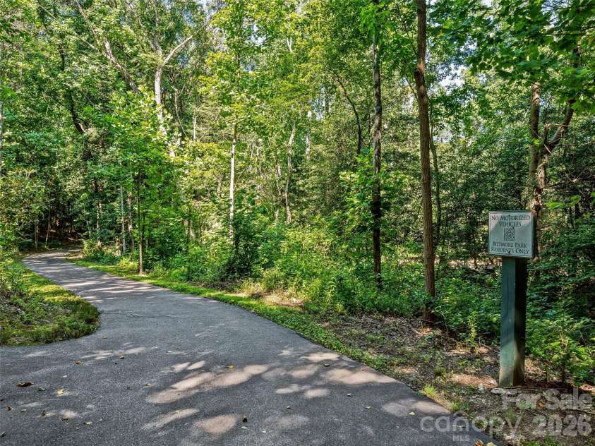 1606 Olmsted Drive, Asheville, NC 28803.  MLS# CAR4407499, YatesRealty ID 42832. Walking paths