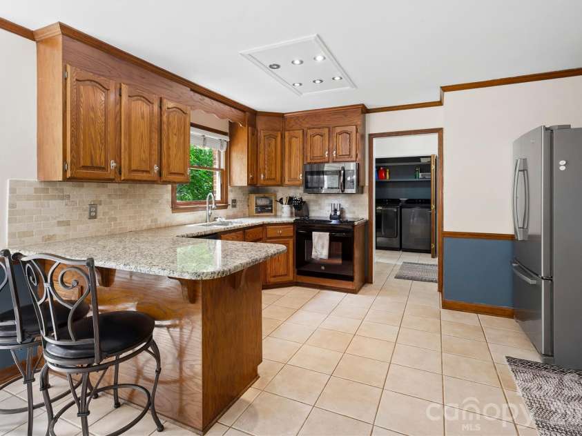 8601 Middleton Circle, Harrisburg, NC 28075.  MLS# CAR4407801, YatesRealty ID 42836. Additional seating at bar