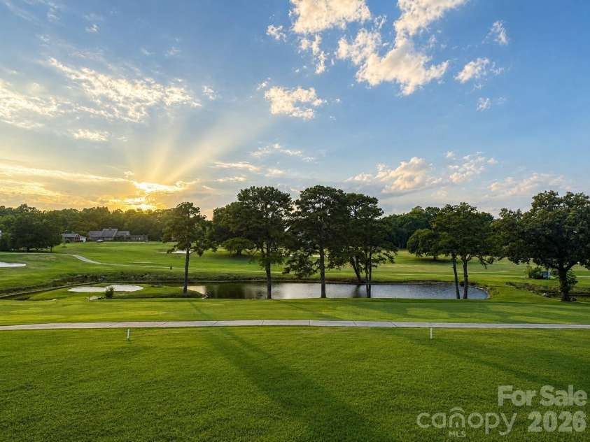1335 Stoneyridge Drive, Charlotte, NC 28214.  MLS# CAR4407877, YatesRealty ID 42846. Sunset view from covered back patio