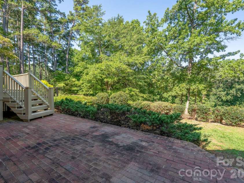 205 Piney Grove Point, New London, NC 28127.  MLS# CAR4409466, YatesRealty ID 42859. Rear Back Yard
