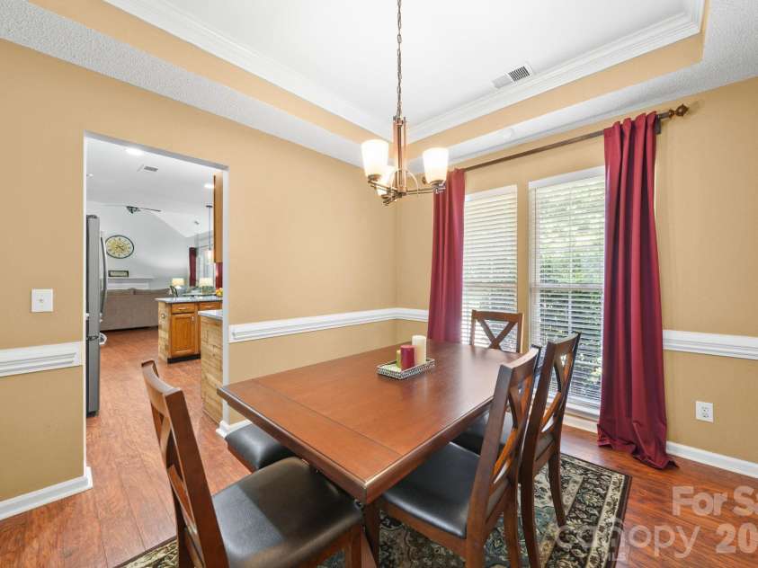 9136 Whittel Place, Charlotte, NC 28216.  MLS# CAR4402060, YatesRealty ID 42872. Formal dining room leads to kitchen.