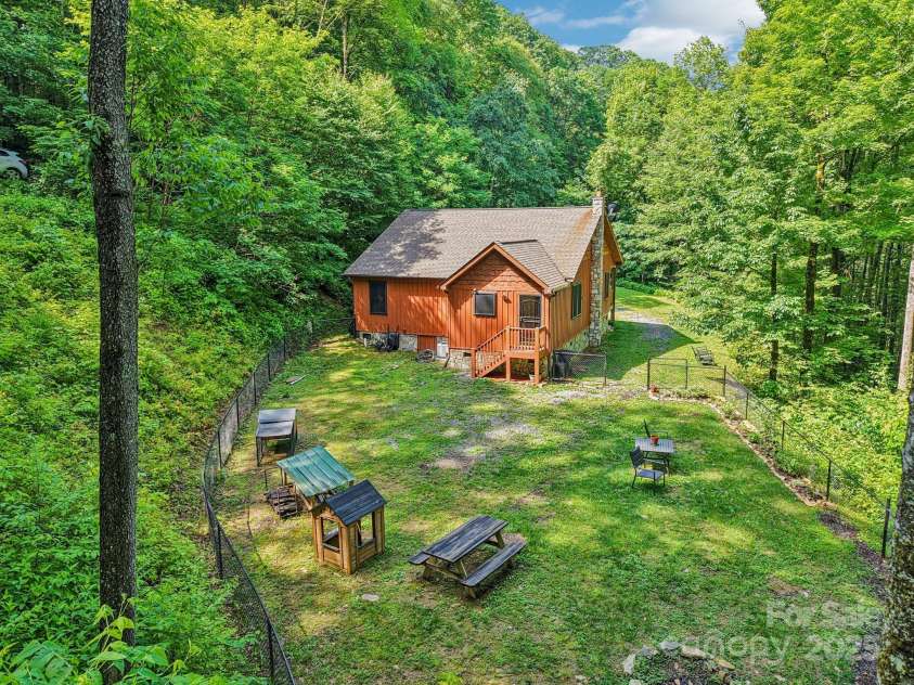 2171 Black Rock Road, Cherokee, NC 28719.  MLS# CAR4270256, YatesRealty ID 4288. Aerial view of fenced back  yard