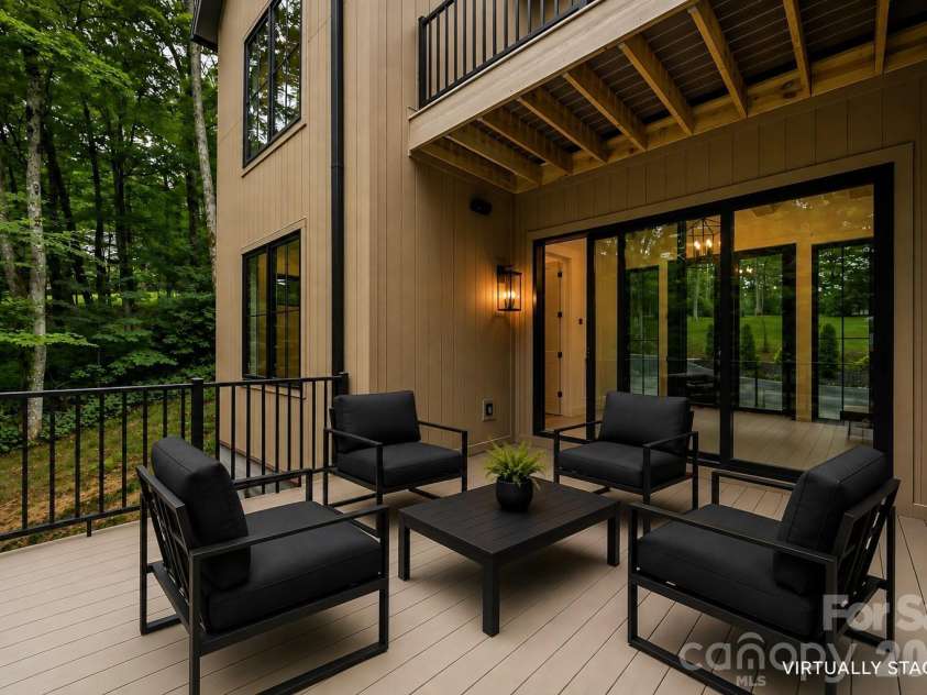 519 Rock Spring Circle, Sugar Mountain, NC 28604.  MLS# CAR4411048, YatesRealty ID 42886. Main Level Back Deck | Virtually Staged