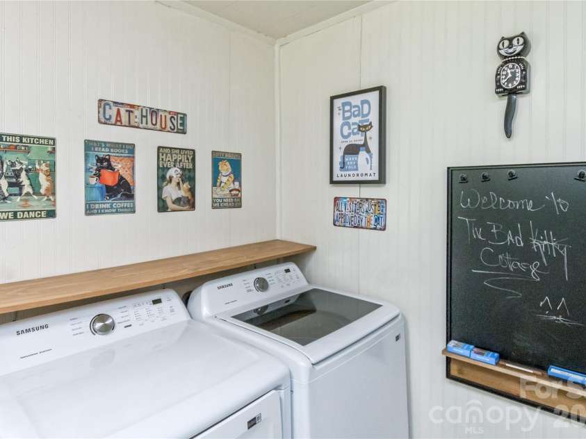 20 Cottage Street, Woodfin, NC 28804.  MLS# CAR4406650, YatesRealty ID 42902. Laundry area in kitchen