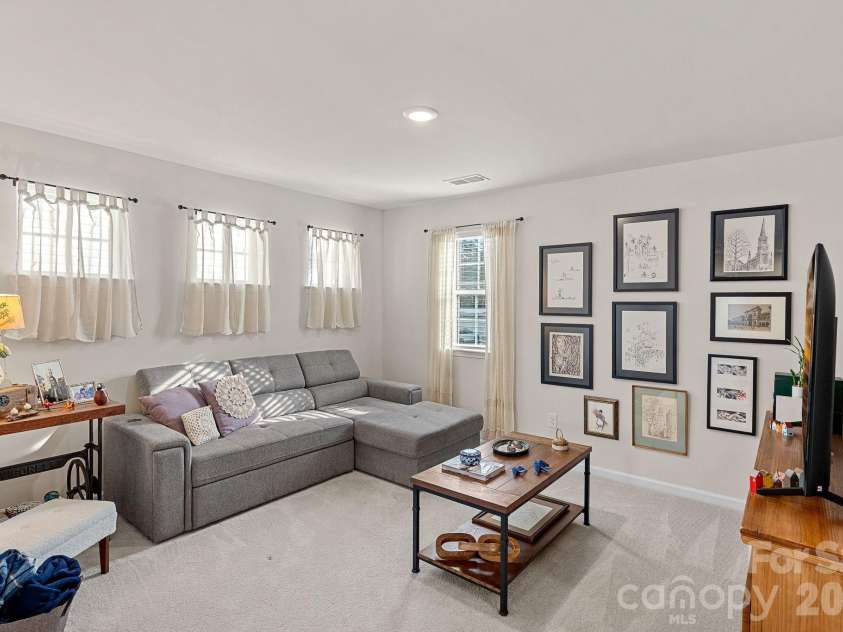 262 Abersham Drive, Mooresville, NC 28115.  MLS# CAR4409392, YatesRealty ID 42916. Bright loft.