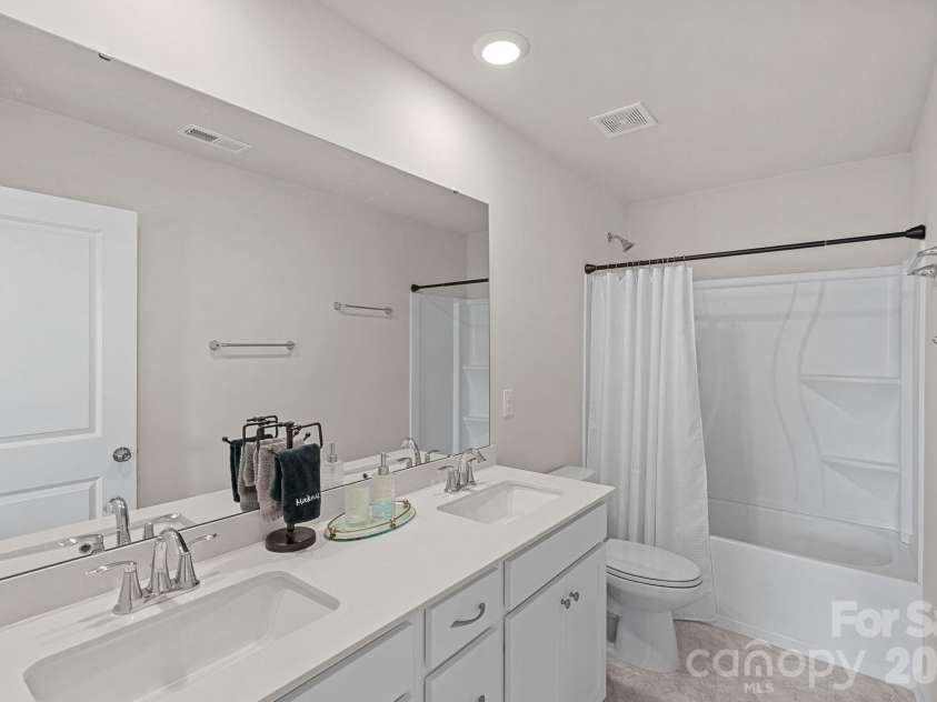 262 Abersham Drive, Mooresville, NC 28115.  MLS# CAR4409392, YatesRealty ID 42916. Guest bathroom shared by 2 bedrooms.