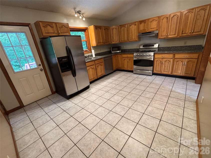 21 Ashwood Drive, Asheville, NC 28803.  MLS# CAR4404647, YatesRealty ID 42917. Kitchen, Wider View