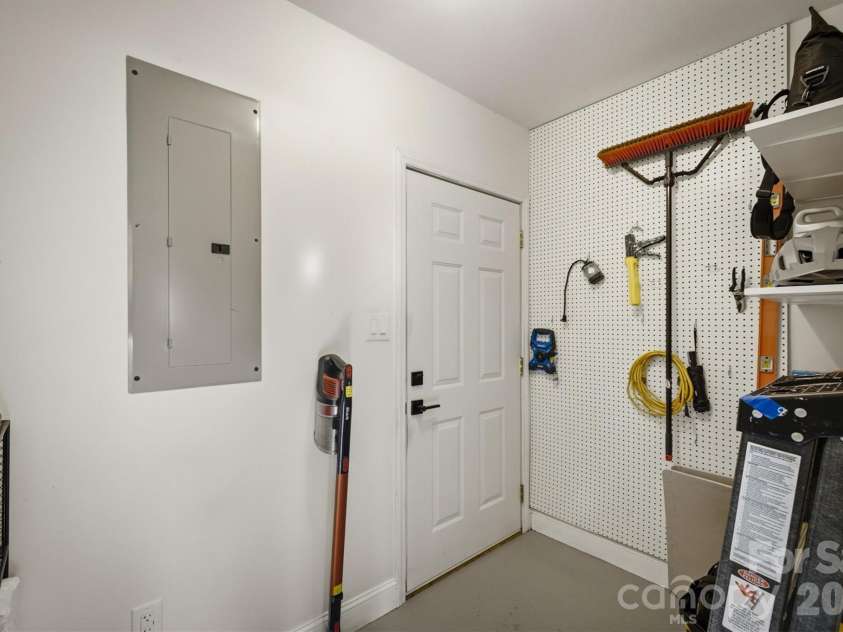 5572 Hayes Waters Road, Morganton, NC 28655.  MLS# CAR4409367, YatesRealty ID 42921. Storage room inside garage