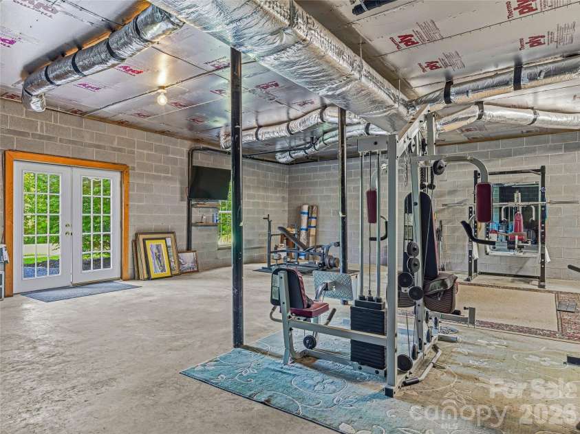 1082 Main Street, Mars Hill, NC 28754.  MLS# CAR4406636, YatesRealty ID 42931. Open exterior basement with high ceilings, ready for your stuff or your vision