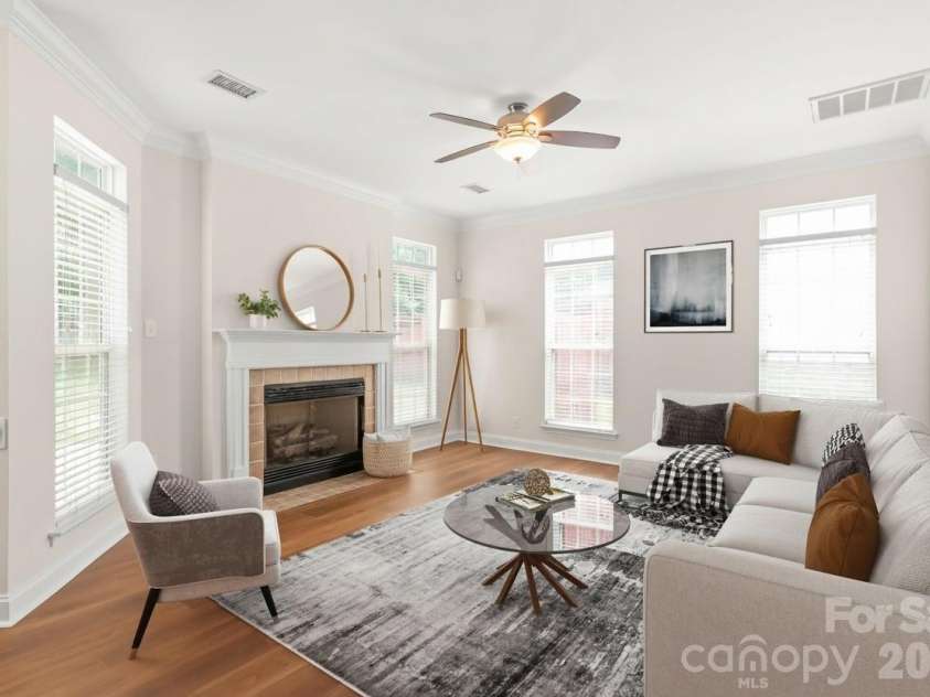 12319 Silveroak Lane, Charlotte, NC 28277.  MLS# CAR4408722, YatesRealty ID 42934. Sunlight pours through generous windows to illuminate the warm open space, highlighting the durable elegance of brand-new LVP floors throughout the main level. Virtual Staging.
