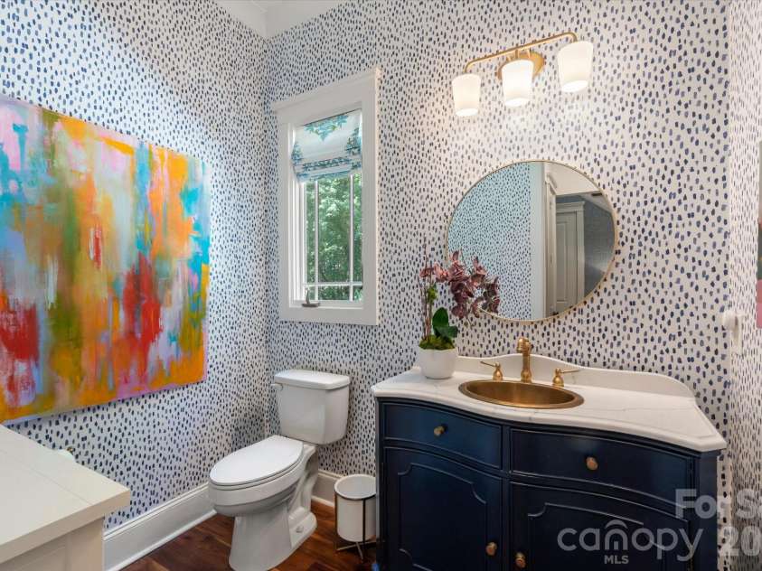 1122 Dobson Drive, Waxhaw, NC 28173.  MLS# CAR4406778, YatesRealty ID 42947. An elegantly appointed main-level half bath showcasing premium designer finishes.