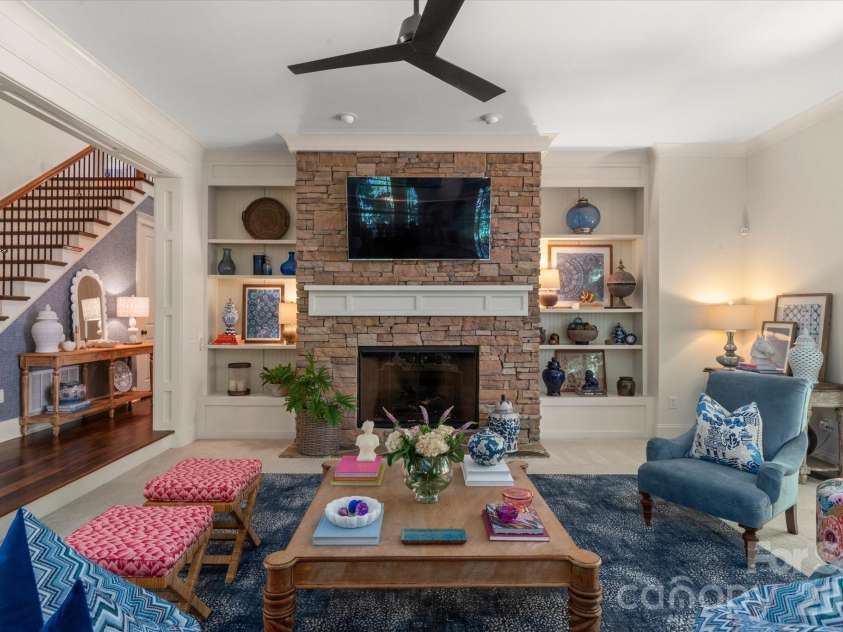 1122 Dobson Drive, Waxhaw, NC 28173.  MLS# CAR4406778, YatesRealty ID 42947. Towering ceilings, commanding stacked-stone fireplace and custom built-ins makes this an inviting place for everyone to gather.