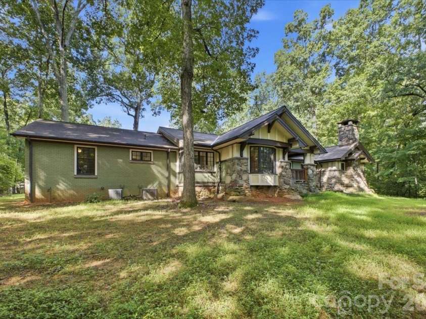 9601 Belt Road, Midland, NC 28107.  MLS# CAR4412563, YatesRealty ID 42969. Front view. Original brick ranch on the left.