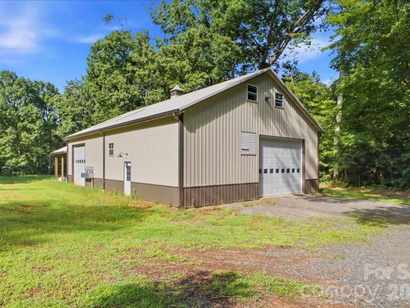 9601 Belt Road, Midland, NC 28107.  MLS# CAR4412563, YatesRealty ID 42969. Huge 40'x76' garage shop.