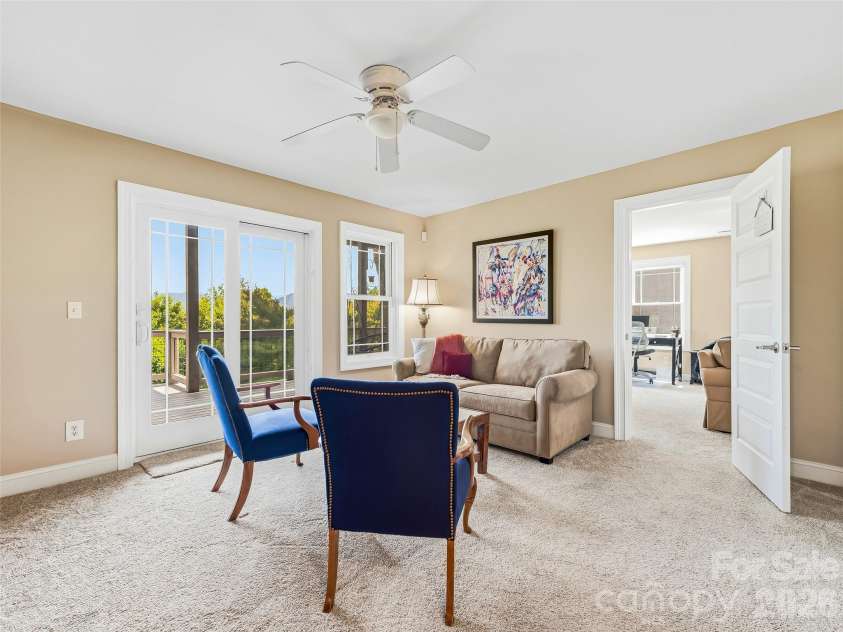 15 Patton Circle, Asheville, NC 28804.  MLS# CAR4402292, YatesRealty ID 42980. Den with access to the full lower deck.