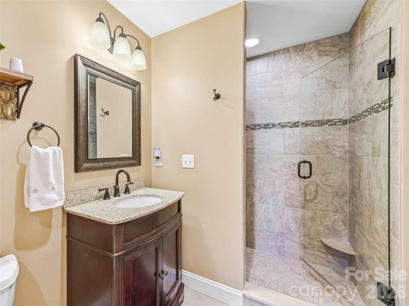 15 Patton Circle, Asheville, NC 28804.  MLS# CAR4402292, YatesRealty ID 42980. Lower level guest bathroom.