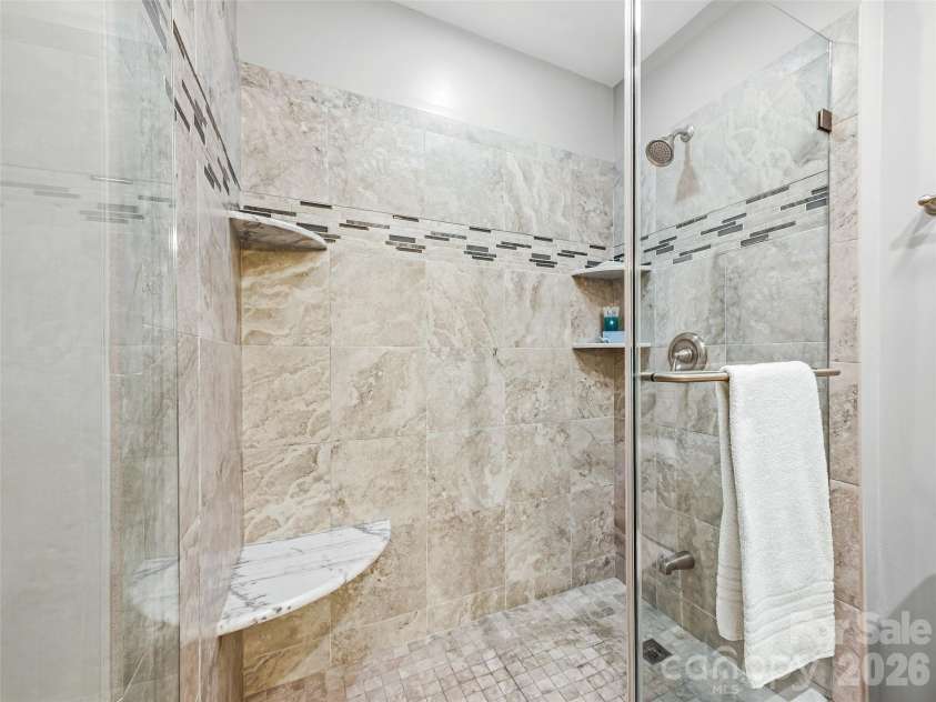 15 Patton Circle, Asheville, NC 28804.  MLS# CAR4402292, YatesRealty ID 42980. Tile and stone primary bath.