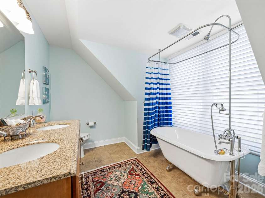 15 Patton Circle, Asheville, NC 28804.  MLS# CAR4402292, YatesRealty ID 42980. Unique and fun guests bath.