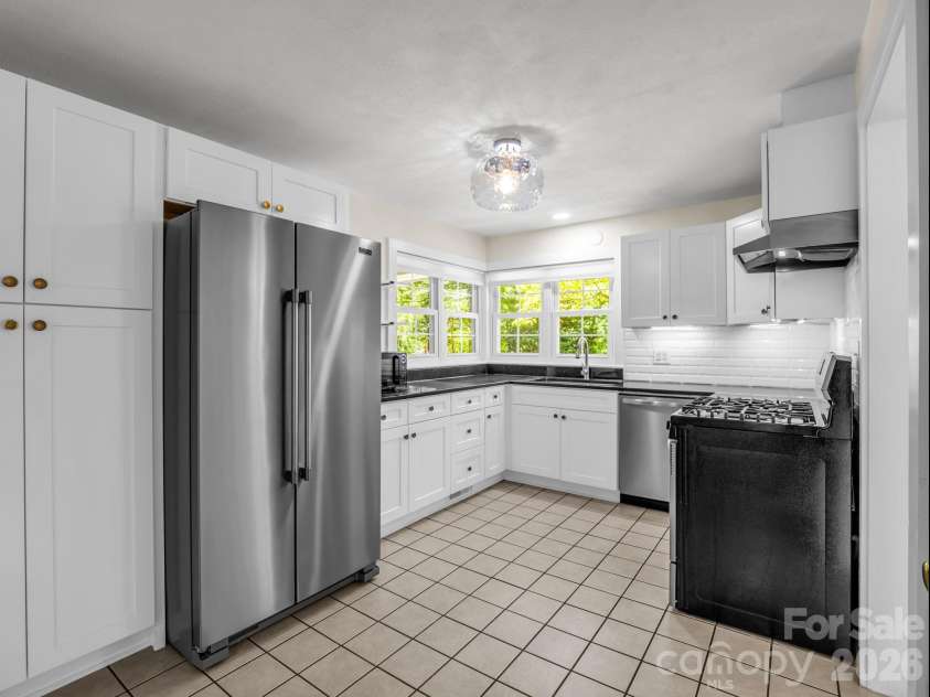 117 Whitney Avenue, Tryon, NC 28782.  MLS# CAR4400518, YatesRealty ID 42984. Updated kitchen with tile floors