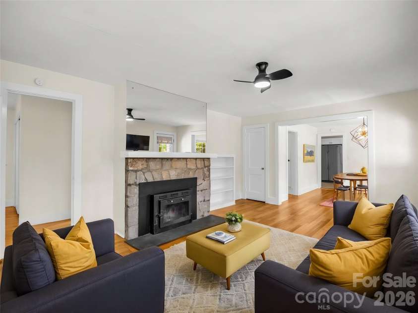 117 Whitney Avenue, Tryon, NC 28782.  MLS# CAR4400518, YatesRealty ID 42984. Virtually staged living room