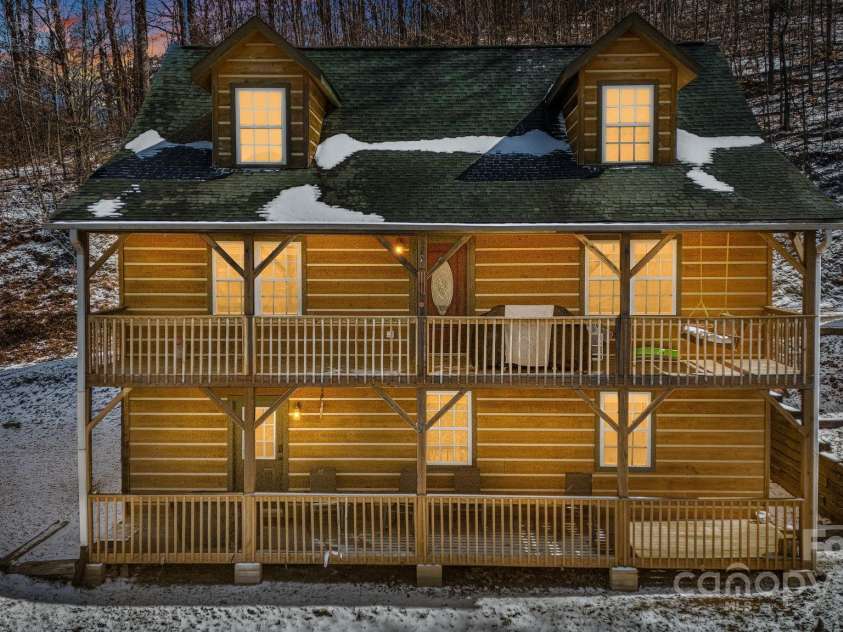 110 Red Wolf Lane, Mars Hill, NC 28754.  MLS# CAR4239848, YatesRealty ID 4299. Evening view of the house