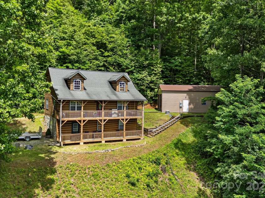 110 Red Wolf Lane, Mars Hill, NC 28754.  MLS# CAR4239848, YatesRealty ID 4299. Front view of the house and garage