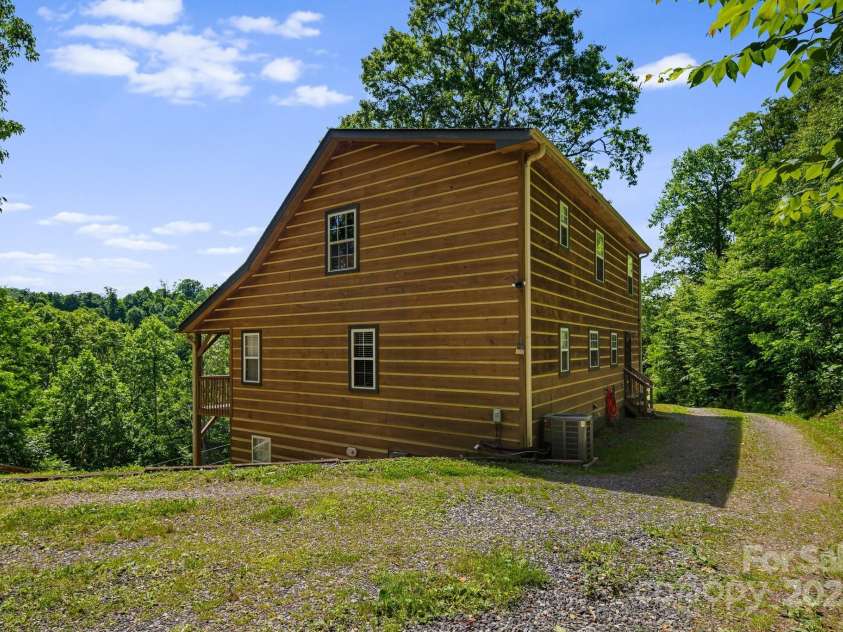 110 Red Wolf Lane, Mars Hill, NC 28754.  MLS# CAR4239848, YatesRealty ID 4299. Side view of house