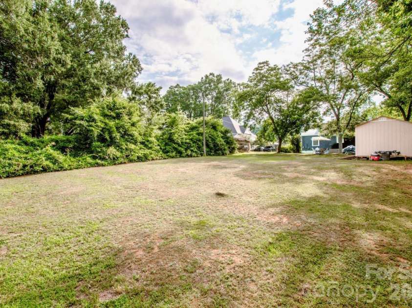 229 Mcneely Avenue, Mooresville, NC 28115.  MLS# CAR4394680, YatesRealty ID 43007. Flat backyard