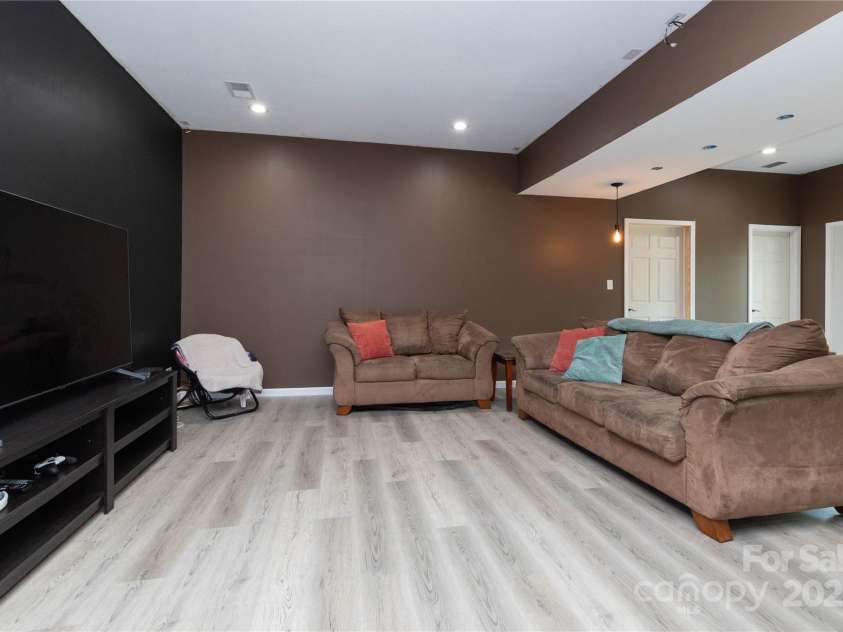 460 Panther Branch Road, Alexander, NC 28701.  MLS# CAR4293485, YatesRealty ID 4301. Den with walkout access