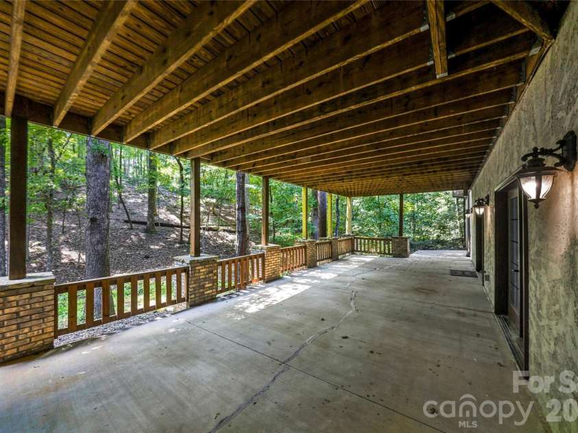 90 Ashley Woods Drive, Arden, NC 28704.  MLS# CAR4392883, YatesRealty ID 43011. Lower Terrace Deck to Fire-Pit