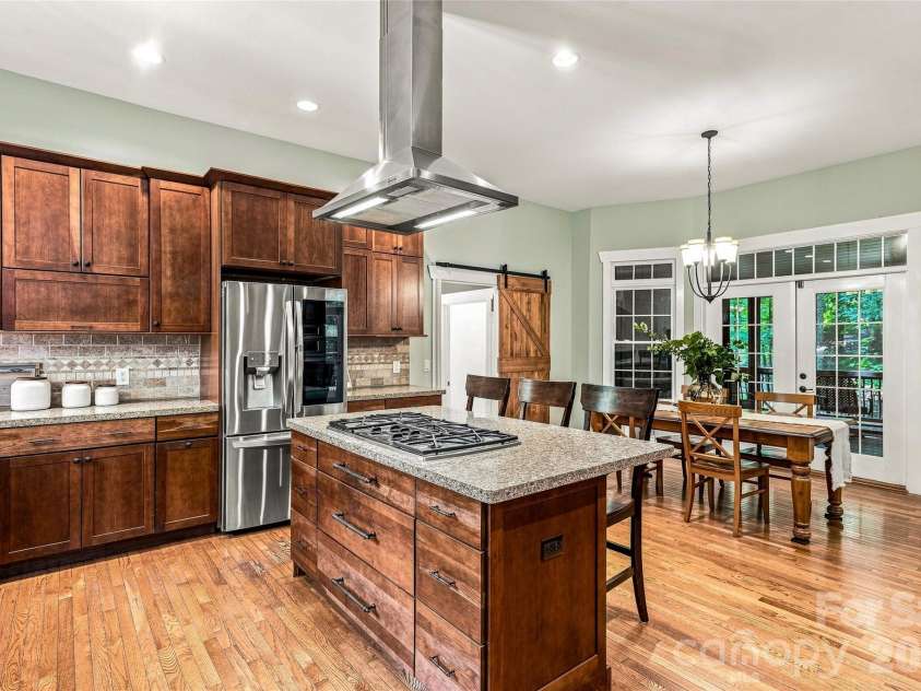90 Ashley Woods Drive, Arden, NC 28704.  MLS# CAR4392883, YatesRealty ID 43011. Open Kitchen to private screened deck