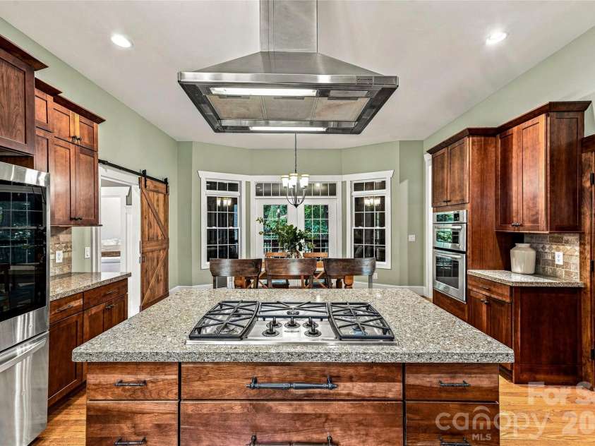 90 Ashley Woods Drive, Arden, NC 28704.  MLS# CAR4392883, YatesRealty ID 43011. Vented hood