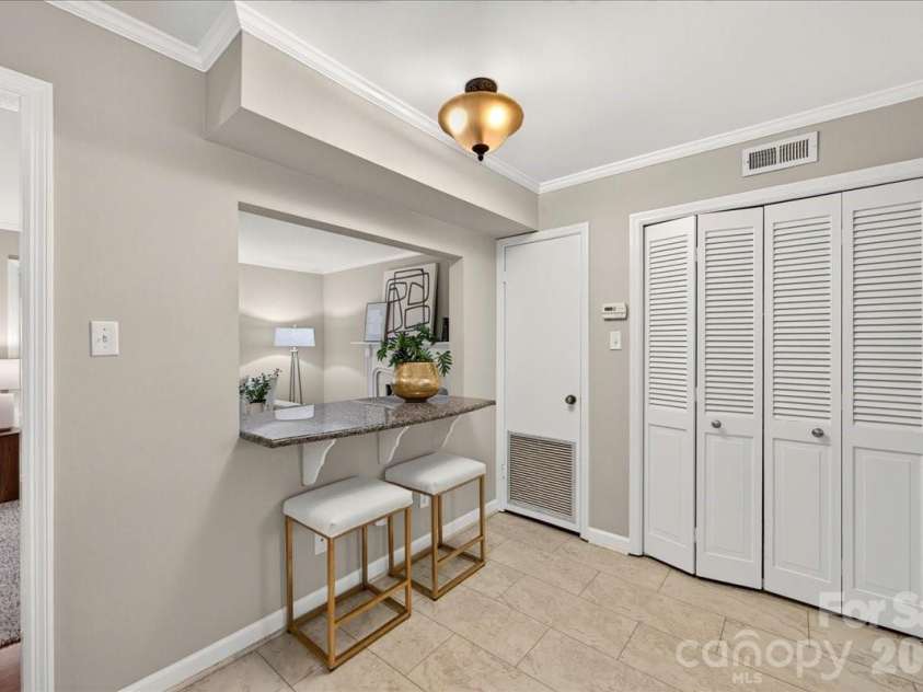 1700 Roxborough Road, Charlotte, NC 28211.  MLS# CAR4405926, YatesRealty ID 43013. Breakfast bar and laundry closet