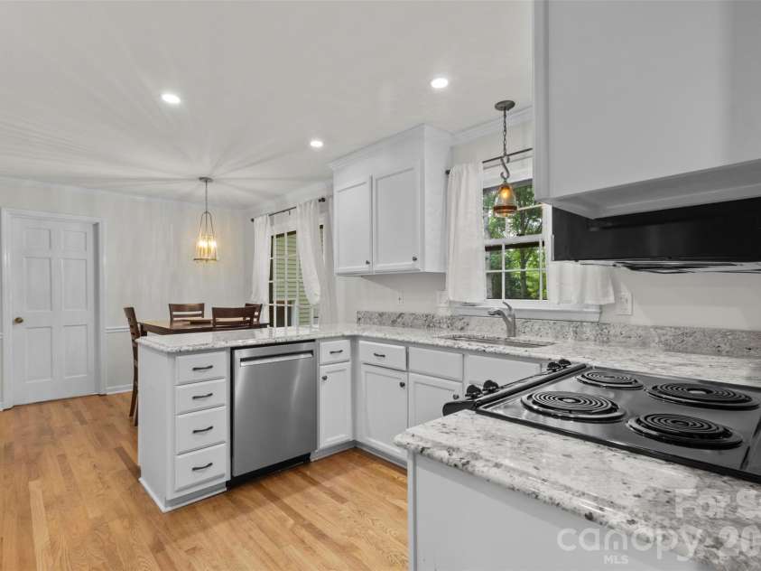 3022 Butter Churn Lane, Matthews, NC 28105.  MLS# CAR4411109, YatesRealty ID 43021. Kitchen – Additional kitchen view highlighting the open layout and convenient workspace.