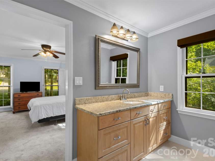 3022 Butter Churn Lane, Matthews, NC 28105.  MLS# CAR4411109, YatesRealty ID 43021. Primary Bathroom – Primary bath featuring dual vanity, ample storage, and direct access from the owner's suite.