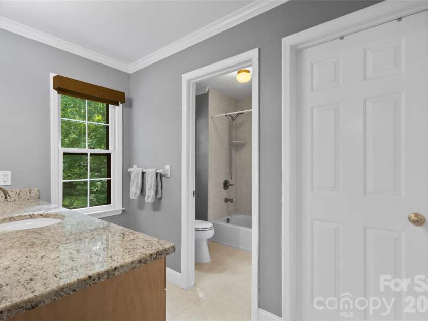 3022 Butter Churn Lane, Matthews, NC 28105.  MLS# CAR4411109, YatesRealty ID 43021. Primary Bathroom – Well-appointed bath with spacious vanity and convenient layout.