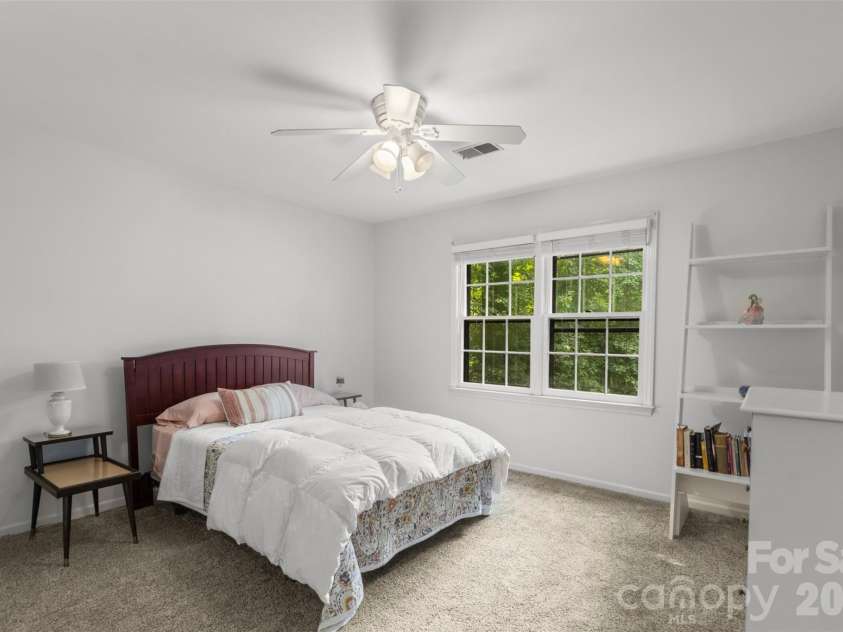 3022 Butter Churn Lane, Matthews, NC 28105.  MLS# CAR4411109, YatesRealty ID 43021. Secondary Bedroom – Comfortable secondary bedroom with ample closet space and bright windows.