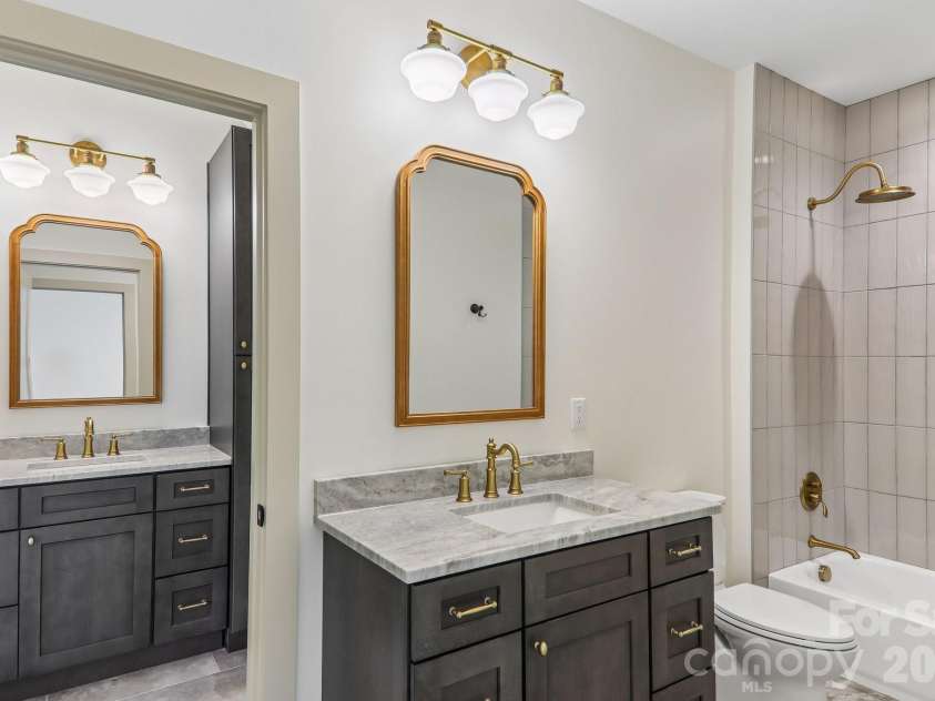 318 Mountain Home Trail, Brevard, NC 28712.  MLS# CAR4405578, YatesRealty ID 43041. 4th bath showing additional vanity attached to bonus room