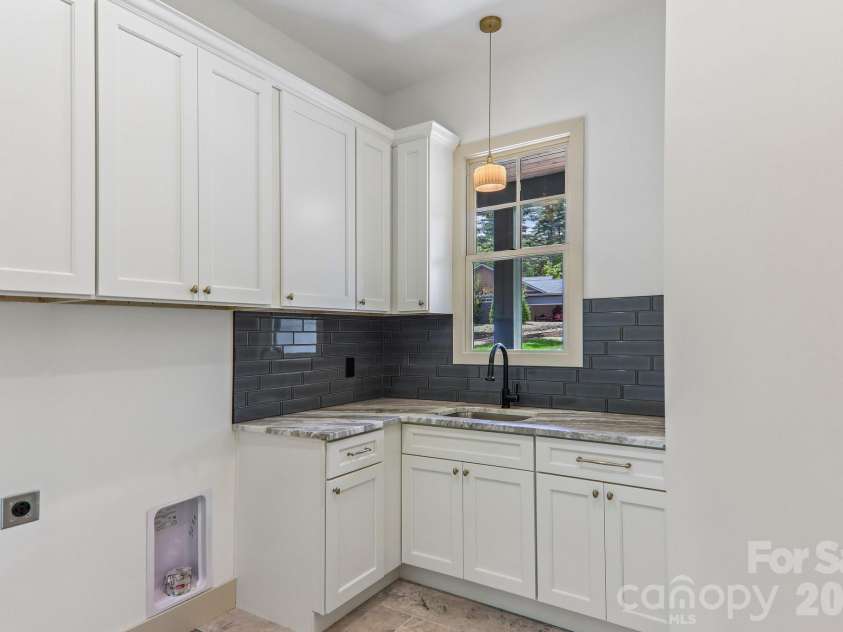 318 Mountain Home Trail, Brevard, NC 28712.  MLS# CAR4405578, YatesRealty ID 43041. Laundry room