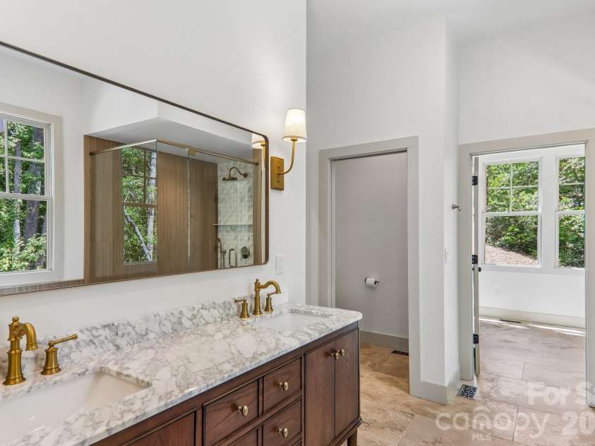 318 Mountain Home Trail, Brevard, NC 28712.  MLS# CAR4405578, YatesRealty ID 43041. Primary bathroom