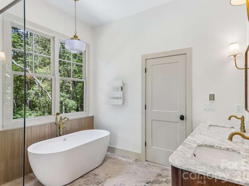318 Mountain Home Trail, Brevard, NC 28712.  MLS# CAR4405578, YatesRealty ID 43041. Primary bathroom