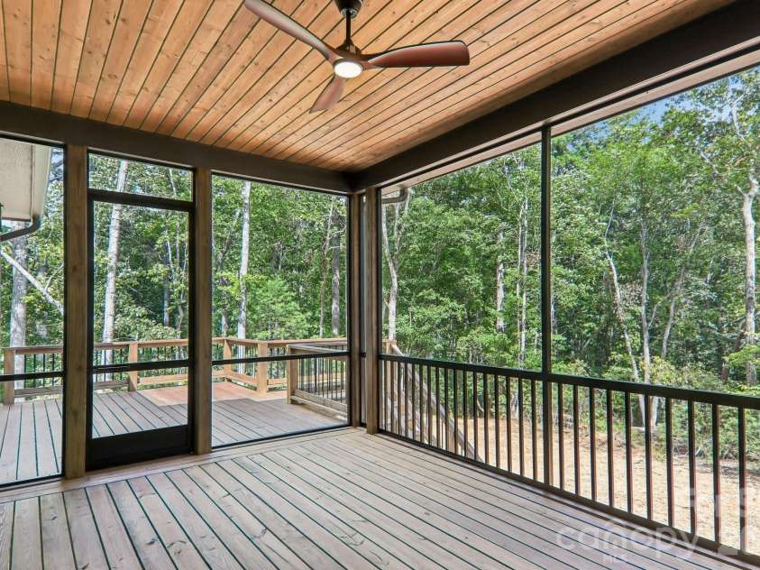 318 Mountain Home Trail, Brevard, NC 28712.  MLS# CAR4405578, YatesRealty ID 43041. Screened porch
