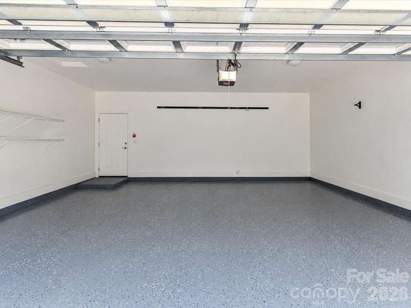439 O'Henry Avenue, Davidson, NC 28036.  MLS# CAR4409491, YatesRealty ID 43051. 2 car attached, rear load garage with epoxy floors.