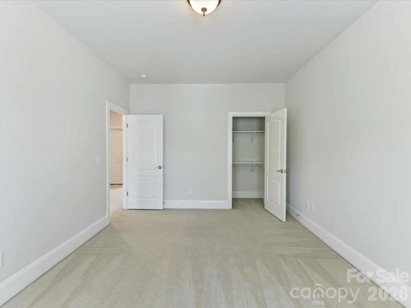 439 O'Henry Avenue, Davidson, NC 28036.  MLS# CAR4409491, YatesRealty ID 43051. Bedroom 2 on upper level with tons of natural light.