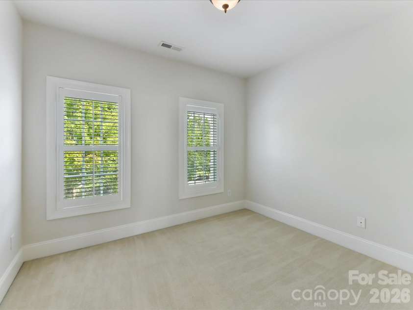 439 O'Henry Avenue, Davidson, NC 28036.  MLS# CAR4409491, YatesRealty ID 43051. Bedroom 3 on upper level features nice natural light.