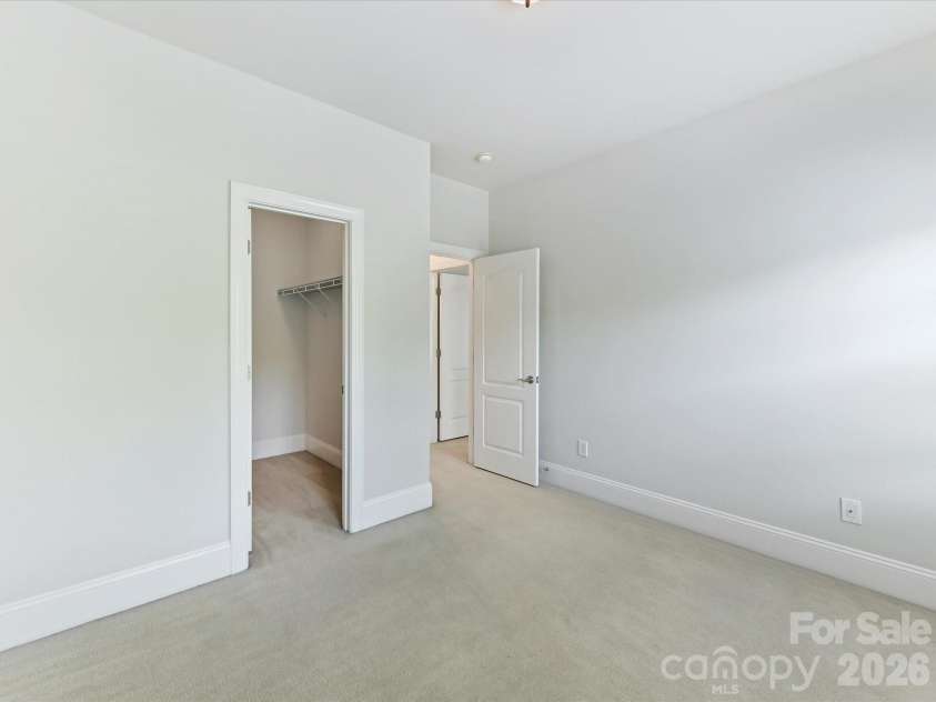 439 O'Henry Avenue, Davidson, NC 28036.  MLS# CAR4409491, YatesRealty ID 43051. Bedroom 3 on upper level features nice natural light.