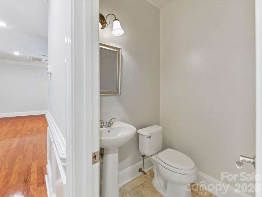 439 O'Henry Avenue, Davidson, NC 28036.  MLS# CAR4409491, YatesRealty ID 43051. Half Bath on main level.