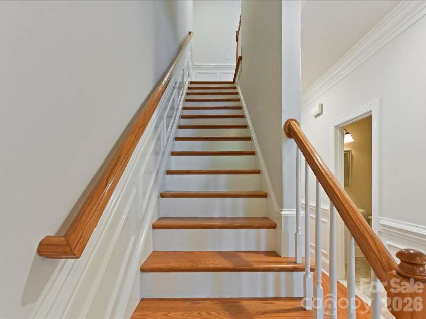 439 O'Henry Avenue, Davidson, NC 28036.  MLS# CAR4409491, YatesRealty ID 43051. Staircase to upper level bedrooms & bonus.