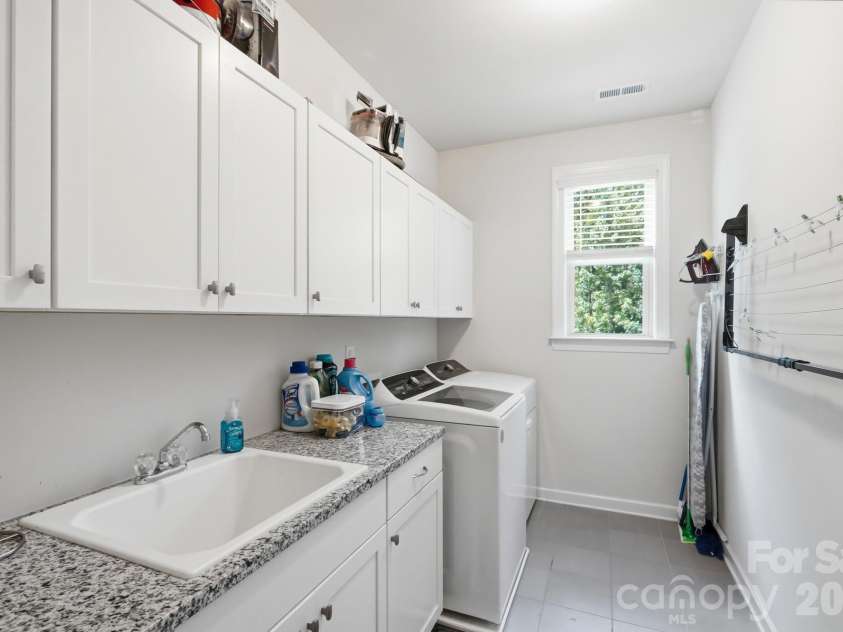 561 Sandbar Point, Clover, SC 29710.  MLS# CAR4412646, YatesRealty ID 43053. Laundry Room w Granite